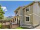 Exterior view of a two-story home with a deck and well-maintained landscaping at 7659 Lebrun Ct, Lone Tree, CO 80124