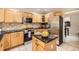 Modern kitchen featuring stainless steel appliances, granite countertops, and ample cabinet space for storage at 7659 Lebrun Ct, Lone Tree, CO 80124