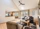 Bright open living area with a view to the kitchen and access to the outdoor deck at 7659 Lebrun Ct, Lone Tree, CO 80124