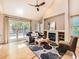 Cozy living room with fireplace, modern rug, and sliding door to the outdoor deck at 7659 Lebrun Ct, Lone Tree, CO 80124