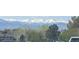 Enjoy the scenic mountain views in the distance, creating a serene backdrop to the community at 7659 Lebrun Ct, Lone Tree, CO 80124