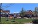 People gathered at a park event with cornhole games and open grassy space at 7659 Lebrun Ct, Lone Tree, CO 80124