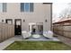 Inviting backyard patio with outdoor seating, a plush ottoman, and well-manicured grass at 1322 Raleigh St, Denver, CO 80204