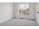 A simple bedroom featuring neutral carpeting and an exterior window at 1322 Raleigh St, Denver, CO 80204