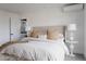 Cozy bedroom with neutral tones, large window and ensuite bathroom at 1322 Raleigh St, Denver, CO 80204