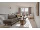 Cozy living room featuring a sliding glass door leading to a balcony or patio at 1322 Raleigh St, Denver, CO 80204