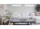 Cozy living room with a plush white sofa, decorative pillows, and a stylish side table at 1322 Raleigh St, Denver, CO 80204