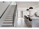 Hallway view of an open floor plan, hardwood floors, kitchen and stairs at 1322 Raleigh St, Denver, CO 80204