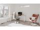 Bright home office with large windows, modern desk, and comfortable seating at 1322 Raleigh St, Denver, CO 80204