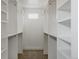 Spacious walk-in closet with custom white shelving and storage for optimal organization at 1322 Raleigh St, Denver, CO 80204