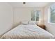 Comfortable bedroom with natural light, neutral tones, and a cozy bed at 3715 Wolff St, Denver, CO 80212