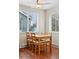 Dining room features a wood table with seating for four, and bright natural light at 3715 Wolff St, Denver, CO 80212