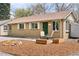 Charming home with a green front door, and lovely landscaping to enhance curb appeal at 3715 Wolff St, Denver, CO 80212