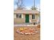 Charming home featuring a well-manicured front yard with mulch and rock landscaping, front porch with seating at 3715 Wolff St, Denver, CO 80212