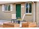 Charming home featuring a well-manicured front yard with front porch seating at 3715 Wolff St, Denver, CO 80212