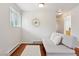 Bright living room with hardwood floors, neutral walls, and a futon at 3715 Wolff St, Denver, CO 80212