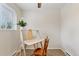 Bright home office with a wooden desk and chair near a window for natural light at 3715 Wolff St, Denver, CO 80212
