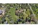 Aerial view showcases the home with a large lot, mature landscaping, lush greenery and neighborhood views at 4480 S Franklin St, Cherry Hills Village, CO 80113