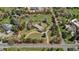 Aerial view highlighting the lot's boundaries, existing home, circular driveway, and surrounding trees at 4480 S Franklin St, Cherry Hills Village, CO 80113