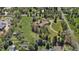 An aerial view showcases the property's size, mature trees, and proximity to residential areas at 4480 S Franklin St, Cherry Hills Village, CO 80113