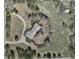 Aerial view of a home and land surrounded by mature trees and circular driveway at 4480 S Franklin St, Cherry Hills Village, CO 80113