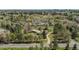 Overhead shot displaying a home with mature landscaping surrounded by trees, grass, and neighborhood views at 4480 S Franklin St, Cherry Hills Village, CO 80113