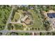 Aerial view of a house on large lot with mature landscaping and winding driveway at 4480 S Franklin St, Cherry Hills Village, CO 80113