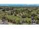 An aerial view of the property displaying a well-maintained landscape, mature trees, and ample space at 4480 S Franklin St, Cherry Hills Village, CO 80113