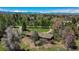 Aerial view of property featuring mature trees and an existing home with a circular driveway at 4480 S Franklin St, Cherry Hills Village, CO 80113