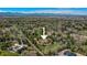 Expansive aerial view of estate-sized lots with mature trees in a desirable neighborhood near the Rocky Mountains at 4480 S Franklin St, Cherry Hills Village, CO 80113