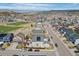 Beautiful aerial shot showcases the home's location near a school, field, and mountains at 3917 Starry Night Loop, Castle Rock, CO 80109
