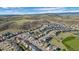 A panoramic aerial view showcases the neighborhood nestled in a valley with rolling hills at 3917 Starry Night Loop, Castle Rock, CO 80109