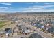 Wide aerial view of a neighborhood with mountain views in the distance at 3917 Starry Night Loop, Castle Rock, CO 80109