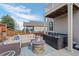 Inviting backyard patio with comfortable seating, fire pit, and relaxing hot tub at 3917 Starry Night Loop, Castle Rock, CO 80109