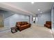 Finished basement with a large leather sofa, a side table, and neutral walls at 3917 Starry Night Loop, Castle Rock, CO 80109
