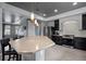 Stylish kitchen featuring a large island with bar seating, stainless steel appliances, and modern finishes at 3917 Starry Night Loop, Castle Rock, CO 80109