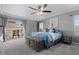 Relaxing main bedroom featuring a ceiling fan, access to a private balcony, and a view of the neighborhood at 3917 Starry Night Loop, Castle Rock, CO 80109