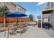 Outdoor patio area featuring a dining table, fire pit and hot tub at 3917 Starry Night Loop, Castle Rock, CO 80109
