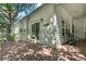 Spacious back porch with sliding glass doors, offering outdoor seating and views of the yard and garden at 6900 W Grant Ranch Blvd # 59, Littleton, CO 80123