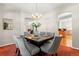 Elegant dining room with modern chandelier and seating for six, perfect for Gathering meals at 6900 W Grant Ranch Blvd # 59, Littleton, CO 80123
