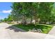 Beautiful home with lush green lawn, mature trees offering shade, and a well-maintained landscape at 6900 W Grant Ranch Blvd # 59, Littleton, CO 80123