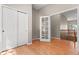 Hallway with wood floors and storage, connecting to additional rooms in the home at 6900 W Grant Ranch Blvd # 59, Littleton, CO 80123