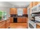 Well-lit kitchen with a window above the sink and sleek black appliances, great for cooking at 6900 W Grant Ranch Blvd # 59, Littleton, CO 80123