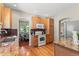 Kitchen with wooden cabinetry, granite countertops and convenient access to dining area at 6900 W Grant Ranch Blvd # 59, Littleton, CO 80123