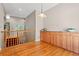 Bright living area featuring hardwood floors, wooden banister and ample storage at 6900 W Grant Ranch Blvd # 59, Littleton, CO 80123