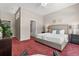 Comfortable main bedroom with seating area and ensuite access at 6900 W Grant Ranch Blvd # 59, Littleton, CO 80123