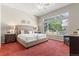 Spacious main bedroom with large window and neutral tones at 6900 W Grant Ranch Blvd # 59, Littleton, CO 80123