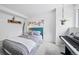 Modern bedroom with piano, bed, and floral decor, offering a serene and inviting atmosphere for a peaceful retreat at 7072 Palisade Dr, Highlands Ranch, CO 80130