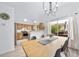 Open-concept dining area with views of the kitchen and backyard at 7072 Palisade Dr, Highlands Ranch, CO 80130