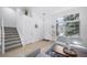 Bright entryway featuring stairs to the second floor, neutral decor, and ample natural light at 7072 Palisade Dr, Highlands Ranch, CO 80130